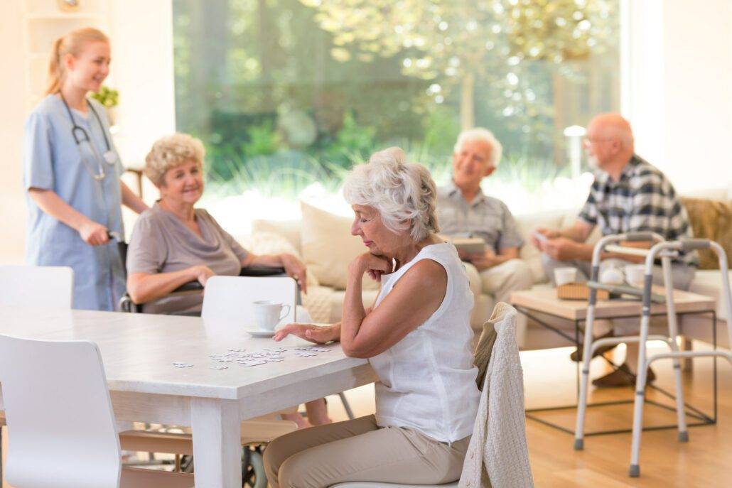 woman doing puzzles in senior living community